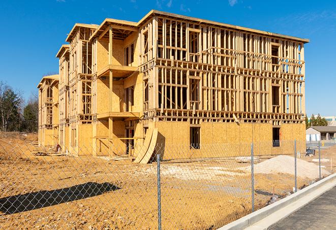 a temporary chain link fence in front of a building under construction, ensuring public safety in Reseda, CA